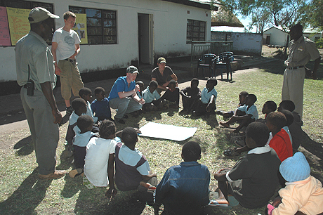 Sitting with the local school in Zambia  Sitting with the local school in Zambia