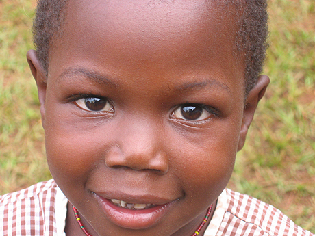 Ugandan girl smiling for the camera Ugandan girl smiling for the camera
